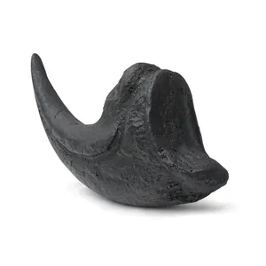 Close-up detail of realistic resin Velociraptor claw fossil replica with rough texture