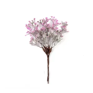 Macro view of artificial heart-shaped purple leaves on a decorative plastic plant bouquet