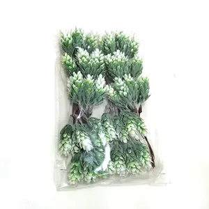 Detailed view of 6 artificial pine cone bouquets in clear plastic packaging for decor