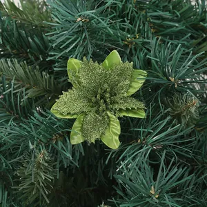 Close-up detail of green glitter artificial poinsettia flower for Christmas tree decoration