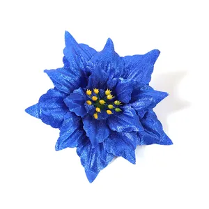 Macro view of a glittering blue poinsettia flower for Christmas tree decorations