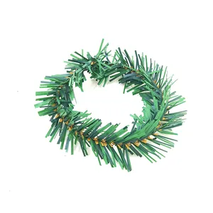 Detail view of artificial green pine needle napkin ring for Christmas table decorations