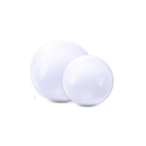 Close-up of two white PVC inflatable beach balls for pool parties and summer water fun.