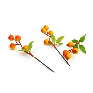 Macro view of 4-head artificial foam pomegranate berries for DIY Christmas tree decor