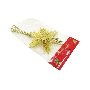 Close-up of gold electroplated snowflake Christmas tree topper with a flexible spring base