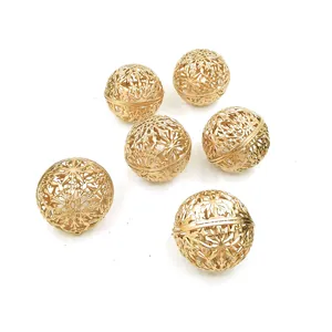 Close-up detail of 6cm golden hollow snowflake Christmas ornaments with glitter finish