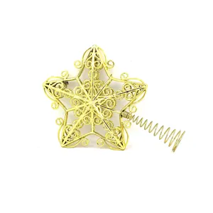 Detailed view of an ornate gold plated Christmas star tree topper with spring base