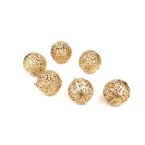 Macro view of six gold filigree hollow decorative Christmas balls for festive holiday trees