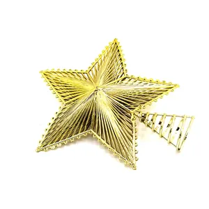 Detailed macro view of a golden plated plastic Christmas star tree topper decoration