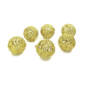 Detailed view of 6cm gold glitter hollow Christmas ball ornaments with intricate patterns.