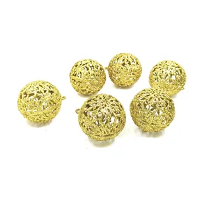 Detailed view of 6cm golden glitter hollow-out Christmas ball ornaments for holiday tree decor
