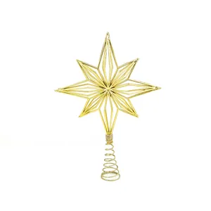 Close-up of golden eight-pointed star Christmas tree topper with spring base