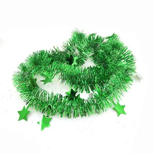Close-up of 2m green star tinsel garland for Christmas and holiday party decoration