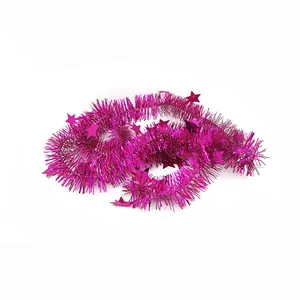Close-up detail of magenta Christmas tinsel garland with sparkling star sequin accents