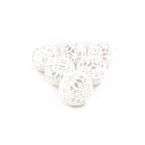 Detailed view of six 6cm white hollow-out glittery Christmas ball ornaments