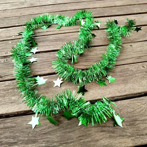 Detailed view of 2m shiny green Christmas tinsel garland featuring star decorations