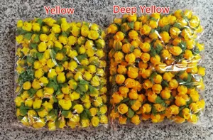 Detailed view of yellow and deep yellow artificial silk rose buds for DIY handicrafts