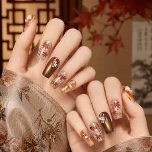 Elegant autumn red-brown maple leaf nail stickers with metallic gold and pearl accents.