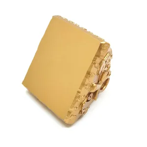 Detailed side view of golden Egyptian souvenir block with intricate carvings