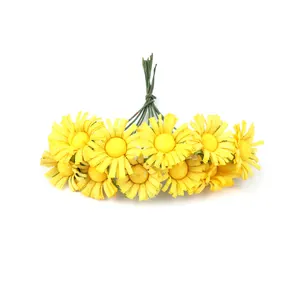 Detailed view of mini yellow artificial sunflowers bundled with realistic green stems