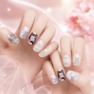 Close-up detail of cute embossed bear nail art stickers with soft pastel patterns