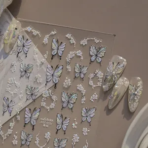 Detailed view of crystal diamond butterfly nail art stickers with delicate flower designs