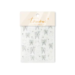 Close-up detail of Tomoni iridescent butterfly and crystal nail art sticker decals