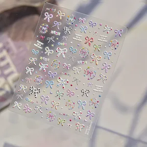Macro detail of 5D embossed nail stickers featuring colorful bows and dots texture