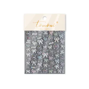 Detail of Tomoni 3D relief nail stickers featuring colorful pastel bow-tie designs
