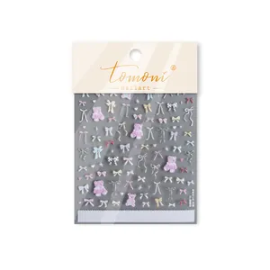 Close-up of Tomoni 3D embossed nail stickers featuring cute pastel bows and bears