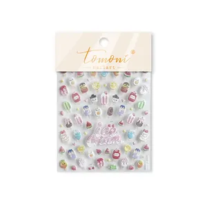 Gros plan des autocollants à ongles Tomoni avec des motifs mignons de fête de glace d'été