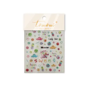 Détail macro des autocollants Tomoni avec visages de dessins animés et texte happy day