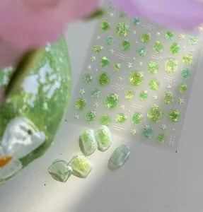 Close-up of 3D jelly shell light green nail art stickers featuring a floral water lily design