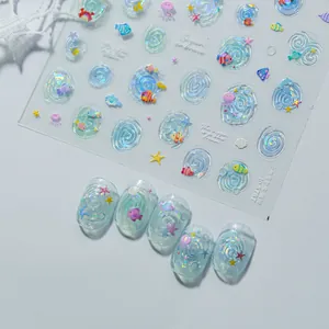 Close-up detail of 3D jelly nail stickers featuring ocean motifs and shell luster.
