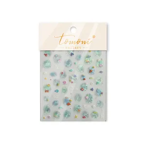 Close-up of Tomoni jelly-style ocean-themed nail art stickers with 3D shell light effect