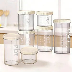 Plastic storage jar detail showing clear scale markings and secure lid for kitchen organization.