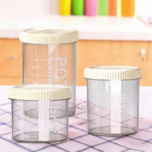 Plastic food storage jar set with scale lines and lids for kitchen grain and snack organization.