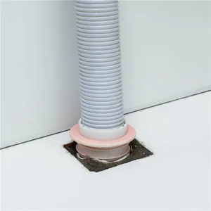 Detailed view of kitchen sewer pipe anti-odor sealing plug and corrugated drain hose.