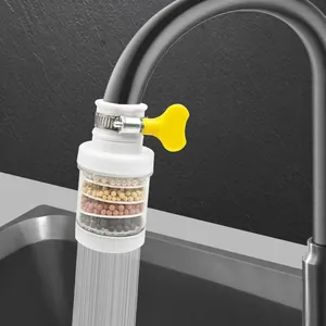 Kitchen faucet water filter detail view showing multi-layer filtration balls and yellow valve.
