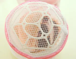 Close-up of pink mesh bra laundry washing bag with support frame, fine mesh design.
