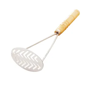 Stainless steel potato masher with wooden handle for easy kitchen food mashing tasks.