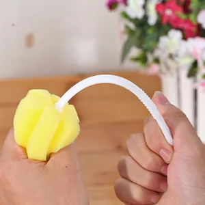 Yellow sponge cleaning brush with white curved handle for effortless bottle and cup washing.