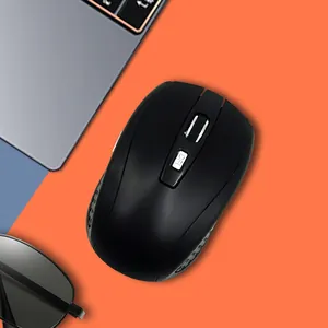 Detail view of a black wireless office mouse with DPI switch button on an orange background.