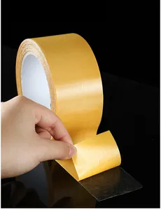 Heavy duty double sided mesh tape detail view showing strong adhesive layer and fiber reinforcement structure