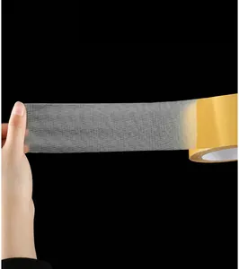Close-up of clear mesh double sided tape detail, showing strong sticky adhesive grid texture.