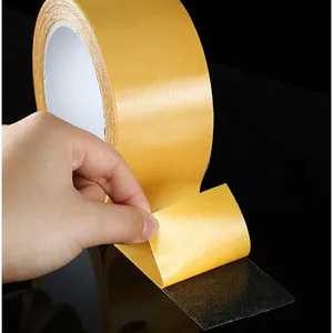 Heavy duty double sided cloth tape roll with strong mesh backing for exhibitions.