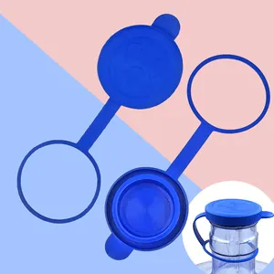 Detailed view of blue silicone bottled water dust cover, flexible reusable dispenser cap seal.