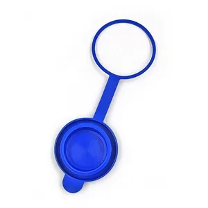 Blue silicone water dispenser dust cover detail showing the flexible hanging ring and sealing cap.