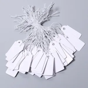 Blank white paper hang tags with strings, ideal for jewelry price labels and craft marking.