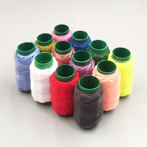Detailed view of colorful sewing thread spools set, neatly arranged for home crafts.